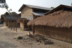 Buildings in the village - note the transition from mud, dung and thatch, to concrete block and tin roof. Sad, one might think, but the thatch has to be replaced every year and mud-walls rebuilt every three - are you going to do it?
